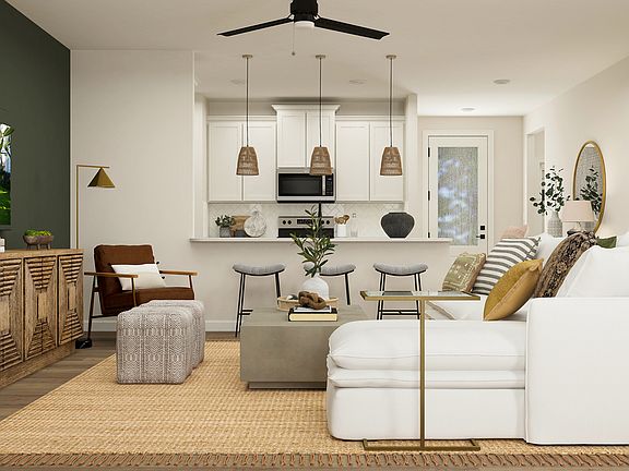 Rendering of a living room that sits right off of a kitchen.