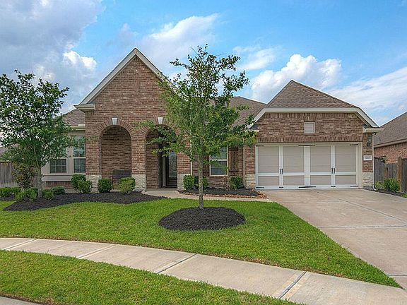 Two car garage with large area for a workshop