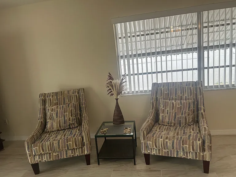 Side area of huge living room near sliding glass doors to patio