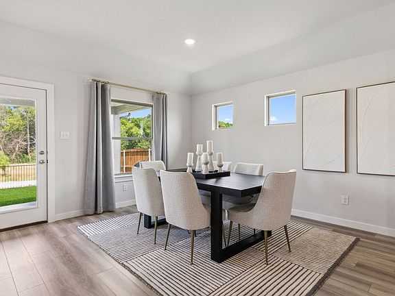 Dining Room in the Emmy II home plan by Trophy Signature Homes - REPRESENTATIVE PHOTO