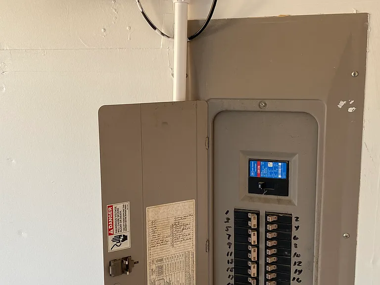 Sprinkler System & Electrical Breaker Panel in Garage