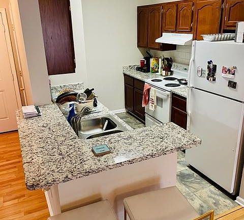 Kitchen with fridge, stove and dishwasher
