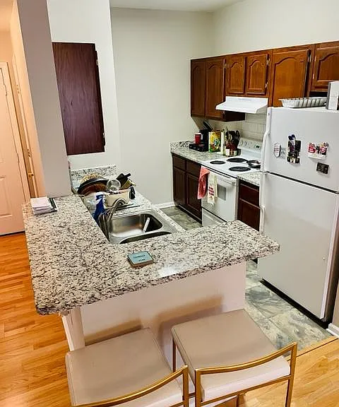 Kitchen with fridge, stove and dishwasher