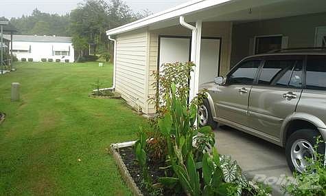 Oversized carport and side view of home