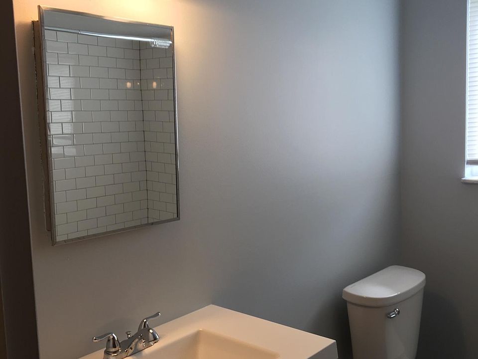 New bath with vanity and tiled shower