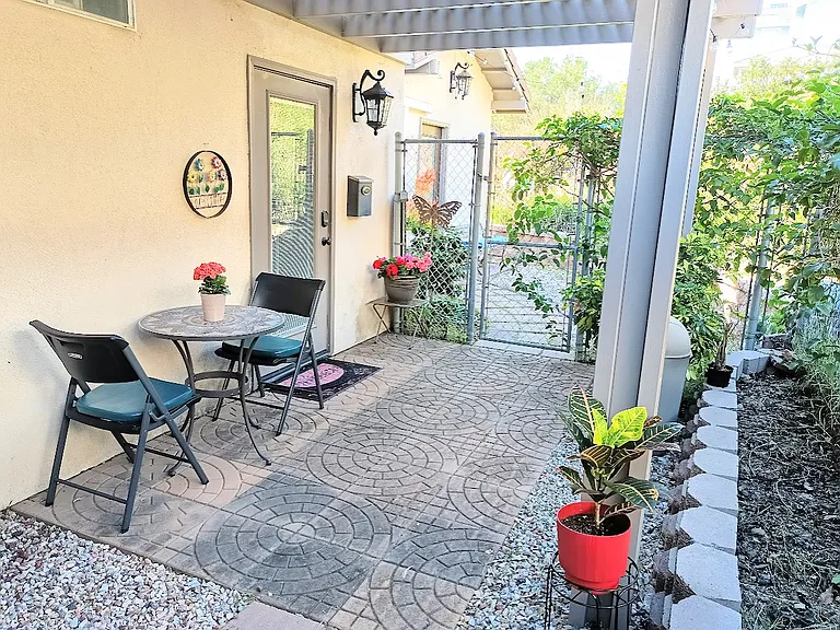Private side yard with shaded patio.