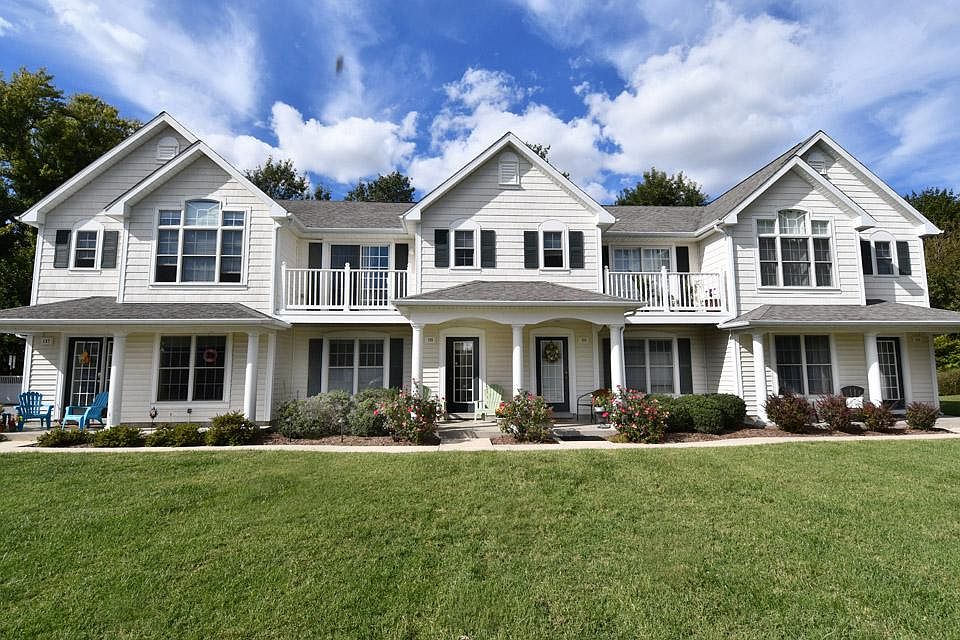 Lots of greenery around the building.