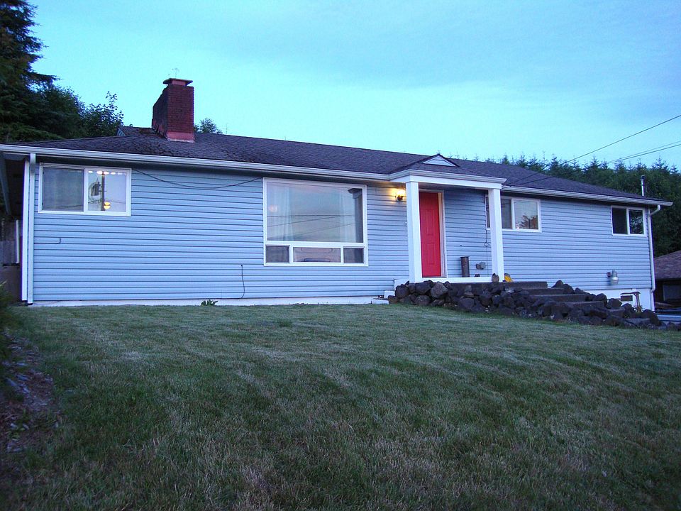 Home sits above the quiet street for expansive views of quaint McCleary