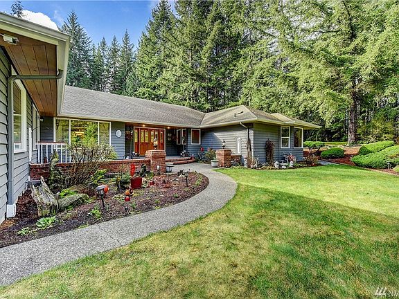 Beautifully landscaped front entry.