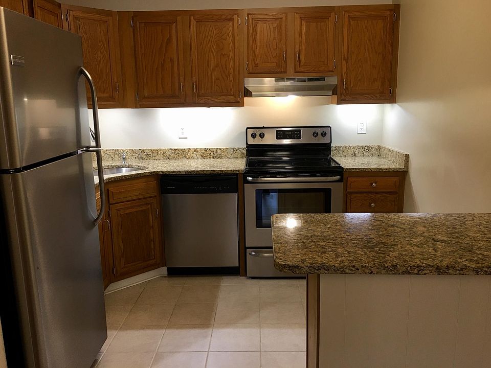 Kitchen with stainless steel appliances and granite counters.