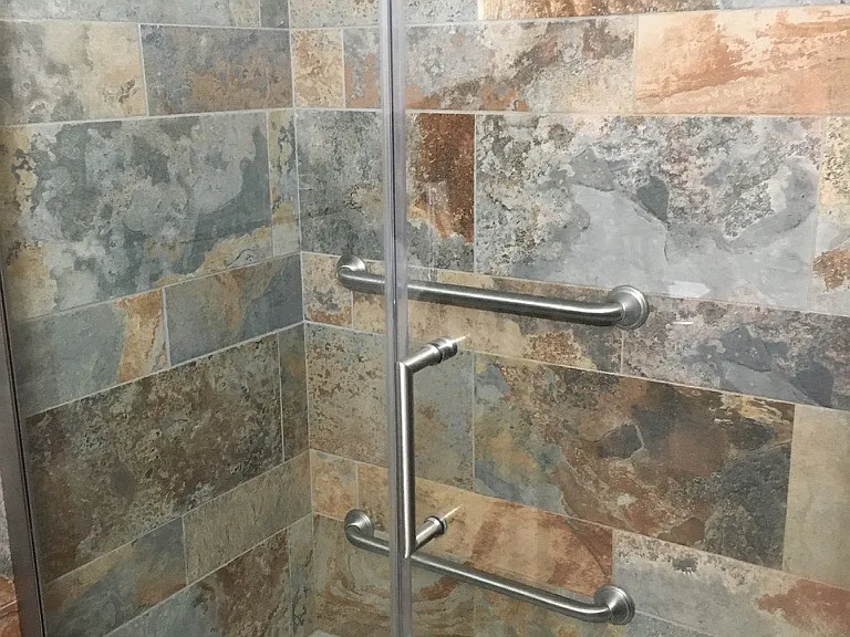 Tile detail of ensuite shower with hand rails