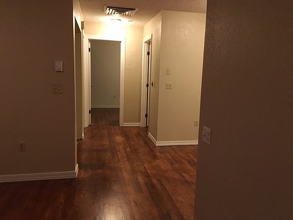 Hallway to both bedrooms and bath