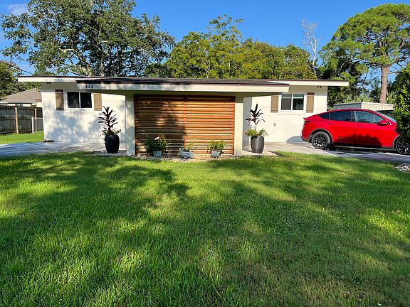 front yard on quiet street on Washington Ave. with a circle drive and extra parking up front