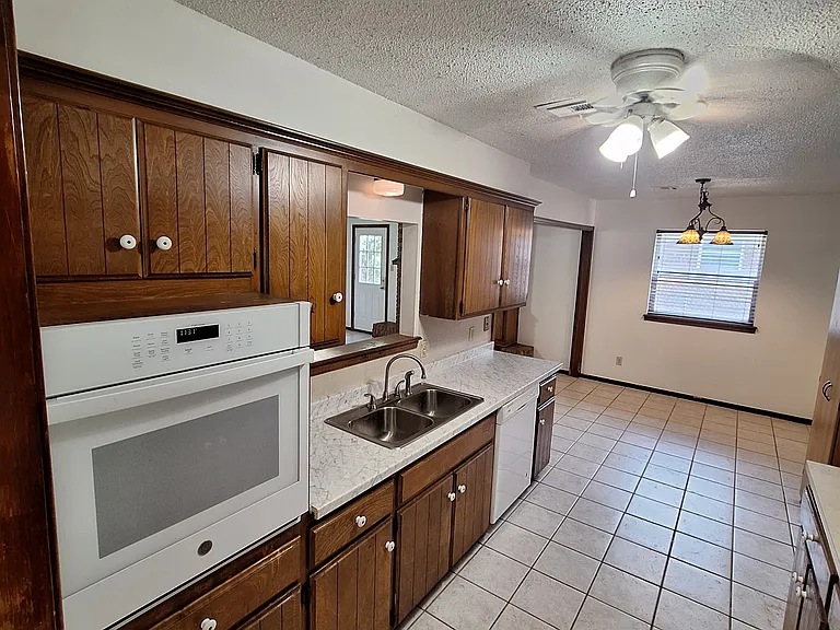 Kitchen oven, sink, and dishwasher