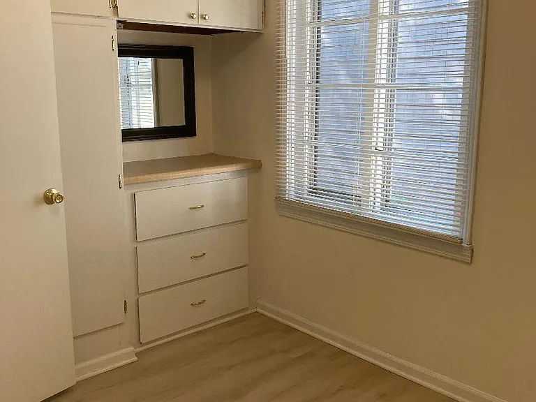Bedroom with built in drawers