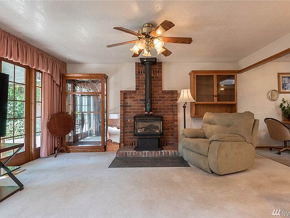 Gas stove is the center of attention in living room.