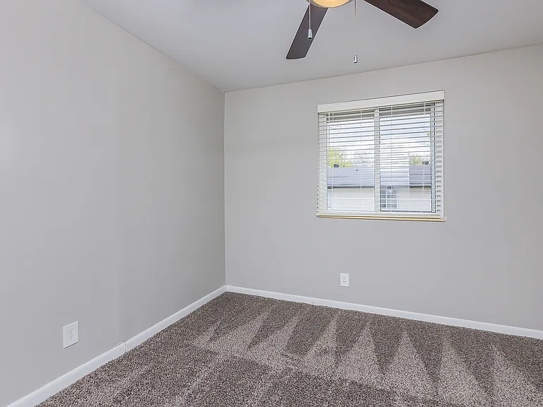 Bedroom with carpet & ceiling fan