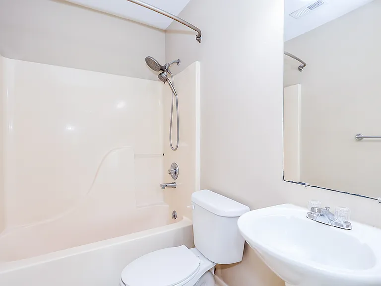 Bathroom with pedestal sink.