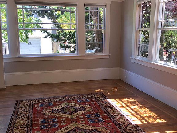large living room area with windows