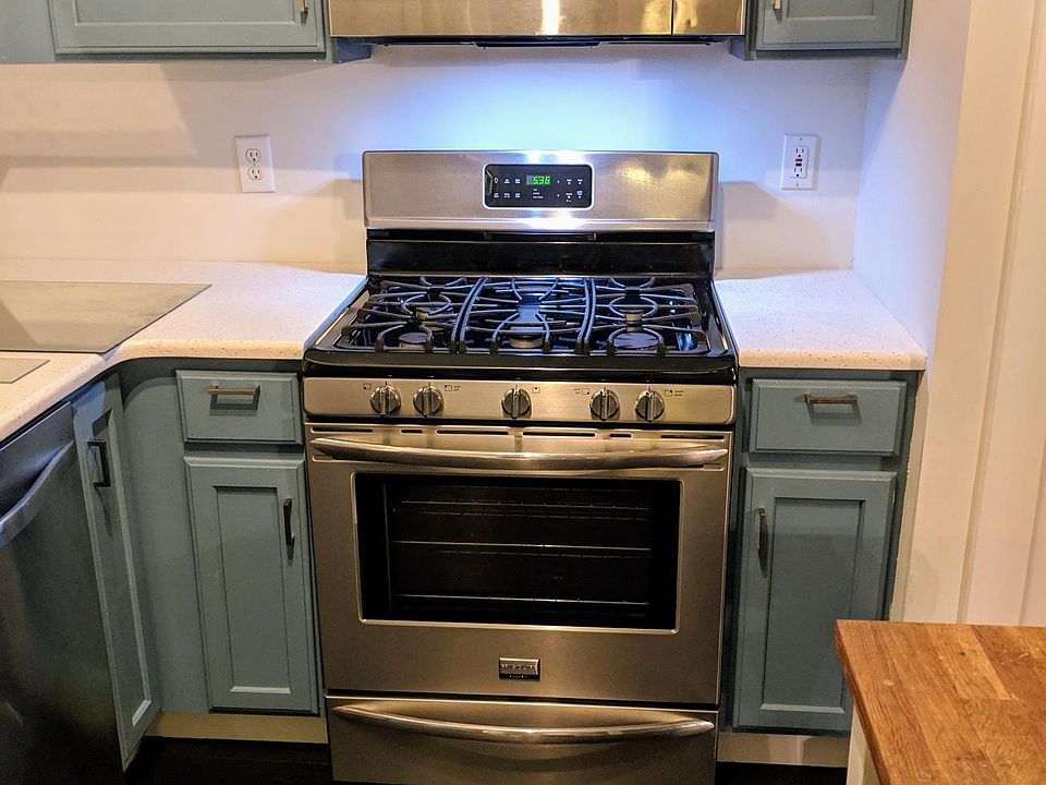 New stainless steel gas range and kitchen appliances.