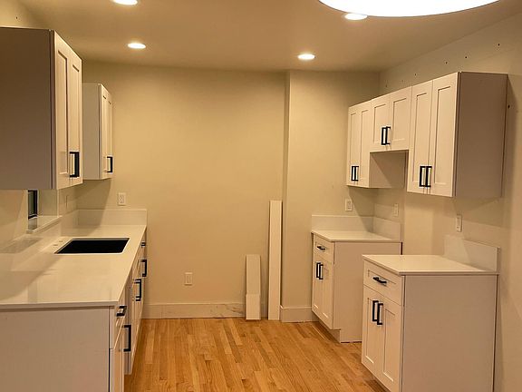 Kitchen (photo taken during remodel). unit has Samsung French door refrigerator, Samsung range, microwave and dishwasher.