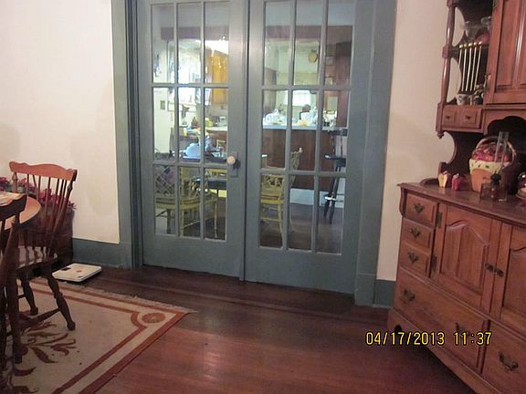 Large formal DR with hardwood flooring and French doors