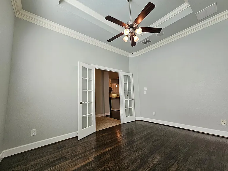 Large office with natural light, tray ceiling and built in speakers