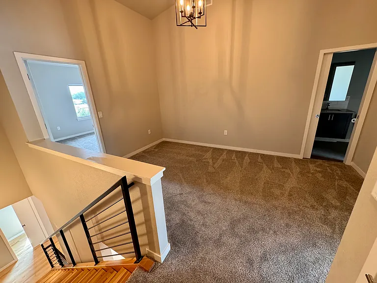 Loft on third floor separating the two primary bedrooms