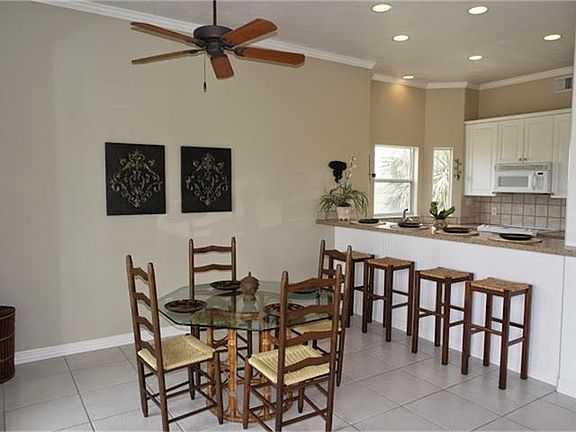 ON THE OTHER SIDE OF THE ROOM YOU WILL FIND THE LOVELY DINING AREA.  THIS OPEN FLOOR PLAN IS PERFECT FOR  VISITING WITH YOUR FRIENDS AND FAMILY.