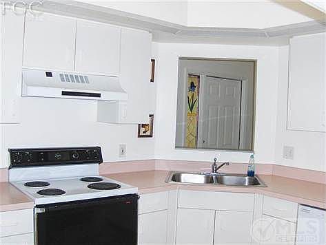 Work area in kitchen with pass~thru window