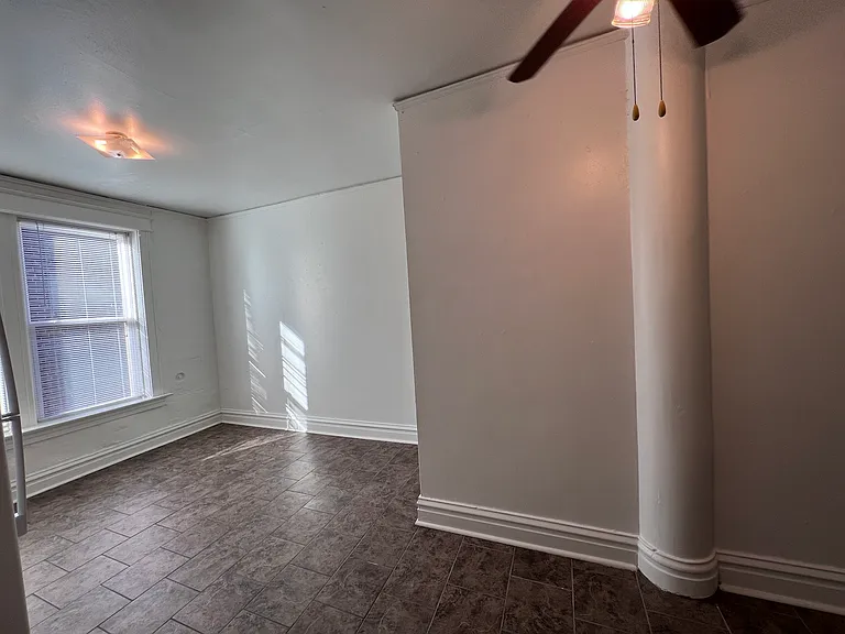 A unique architectural partition creates natural separation within the space.