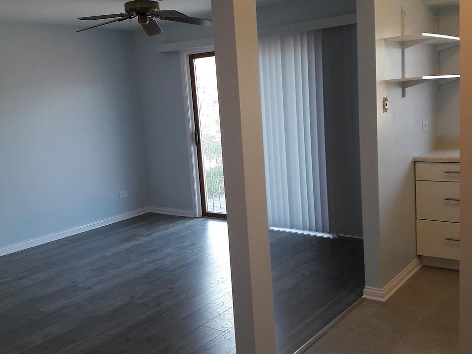 Kitchen view thru to Living area with balcony