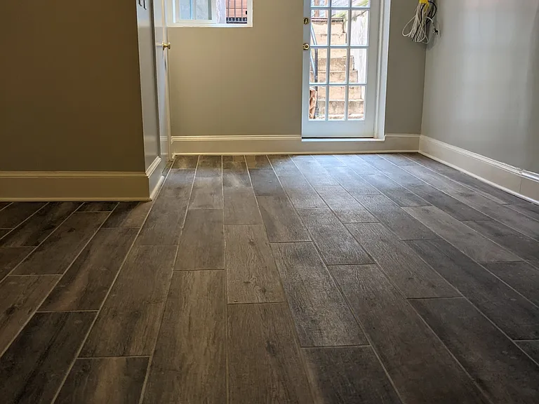 Bedroom from entrance facing back door. Second large closet at back left.