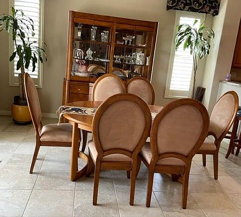 Spacious Dinning room, which has not only the nicely decorated side windows with shutters, and an entrance on the left, from the back garden
