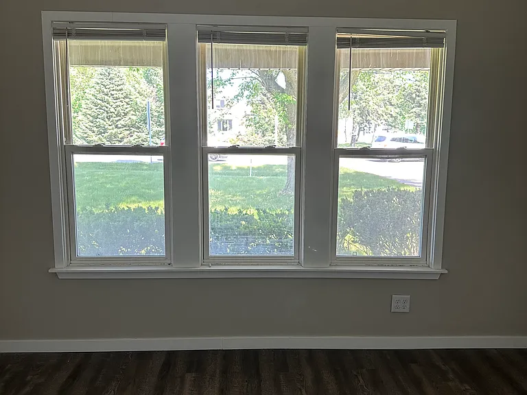 Windows in the master bedroom; overlooks front yard