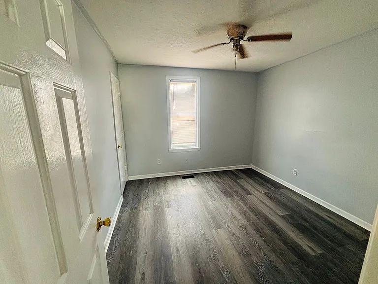 Nice size bed room with ceiling fan