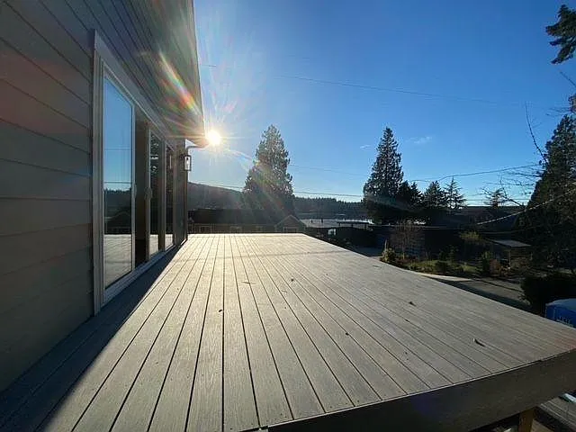 Large deck with 10 foot sliding glass door. Railings are installed.