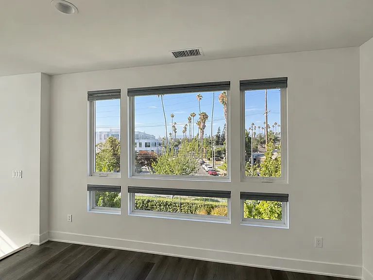 Dining room area with views of Hollywood sign, mountains, and DTLA.