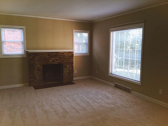 Living room with new fireplace surround and lots of light