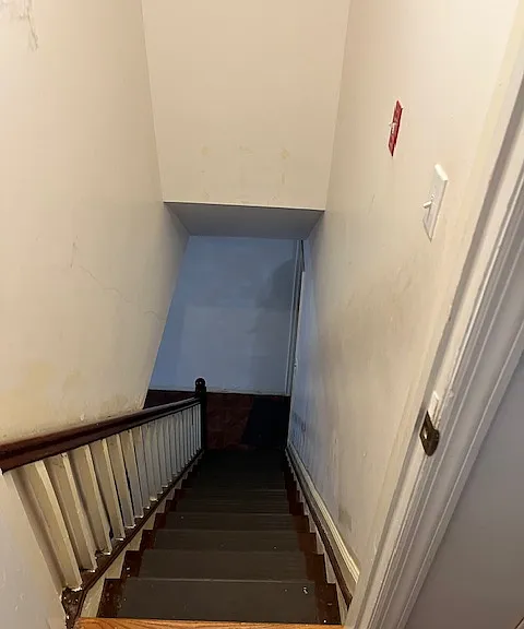 DOWNSTAIRS TO FULL FAMILY ROOM AND BATH NUMBER TWO AND BACKYARD
