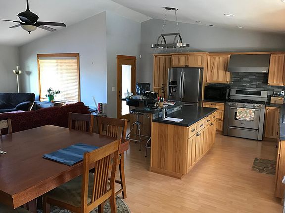 Dining,kitchen,livingroom, door to private/covered patio.