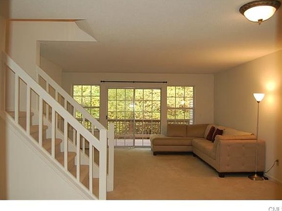 Large Living Room with Dining Area and Sliders to Oversized Private Deck