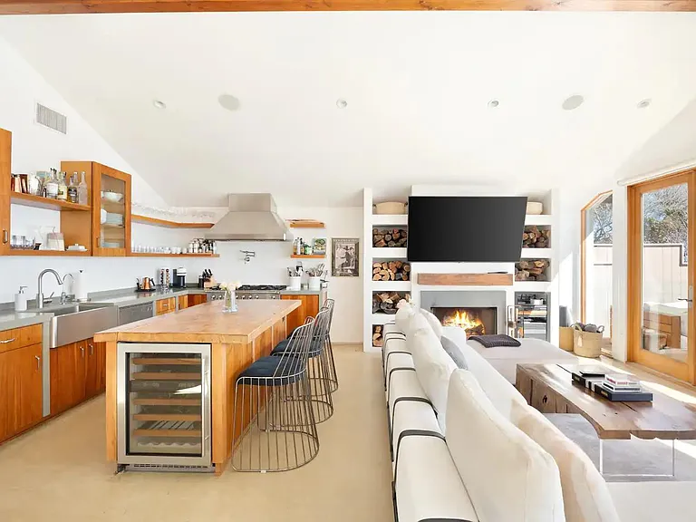 A stunning open faced kitchen with wooden features.