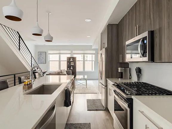 Main floor with kitchen, living room, and dining room