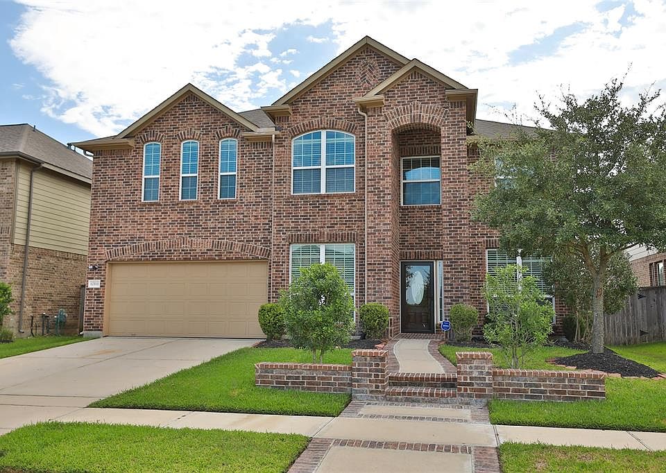 This pretty home is 4 sides brick and a covered front entry.
