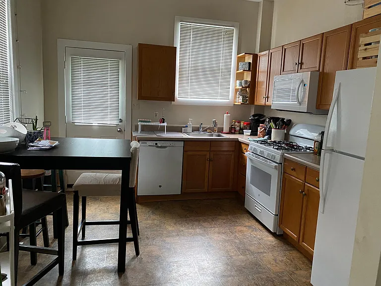 Kitchen includes refrigerator, stove, microwave and dishwasher