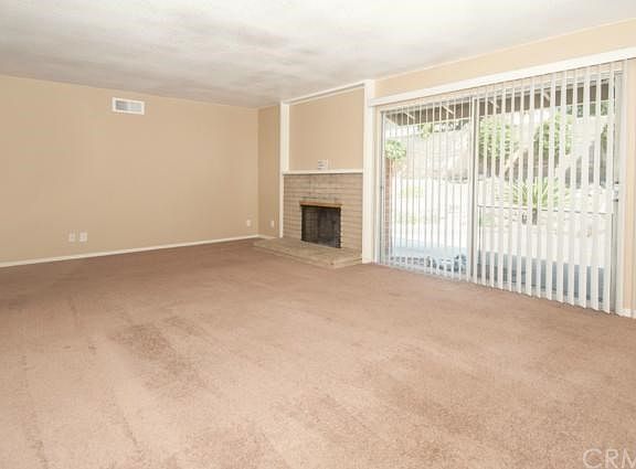 Spacious Living Room with Access to Patio and Back Yard.