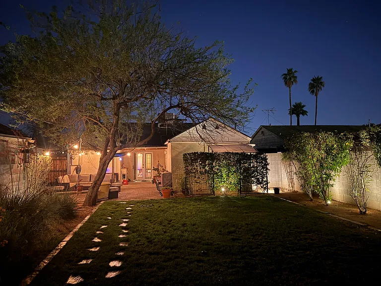 lush backyard. twice-monthly lawn care included in rent