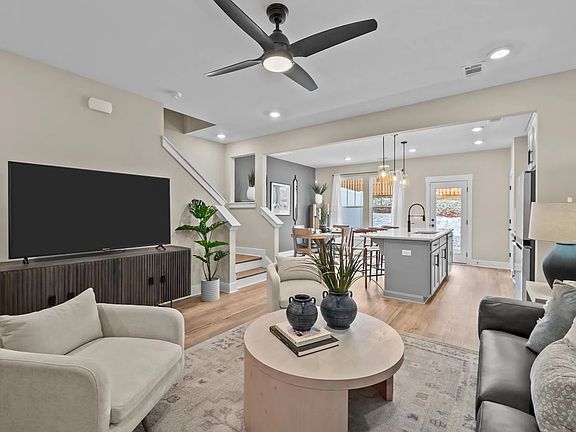 Exceptional family room with hardwood flooring in this exclusive DRB Homes townhome
