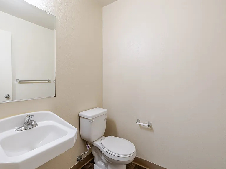 Bathroom B offers a clean, minimalist space designed for comfort and functionality.